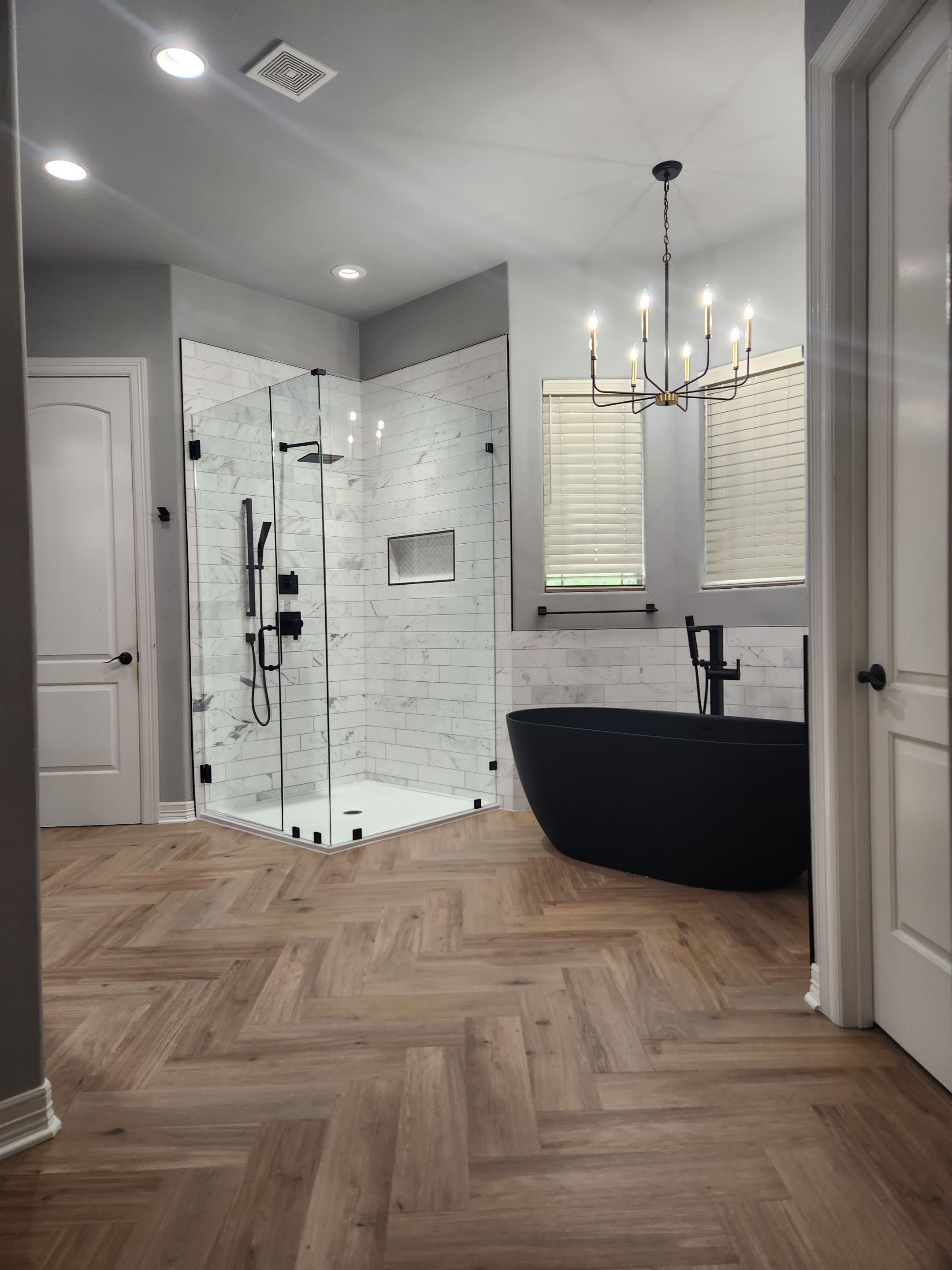 wide view of a san antonio master bathroom remodel featuring modern shower and tub