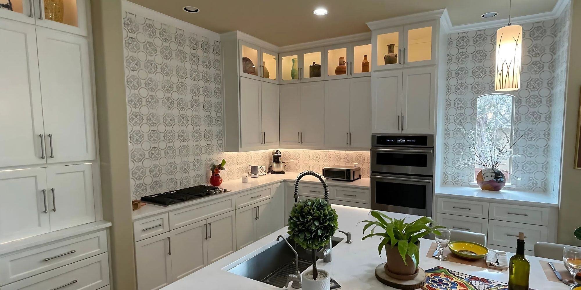 large san antonio kitchen renovation with large kitchen island, white cabinets, and statement gray and white patterned backsplash