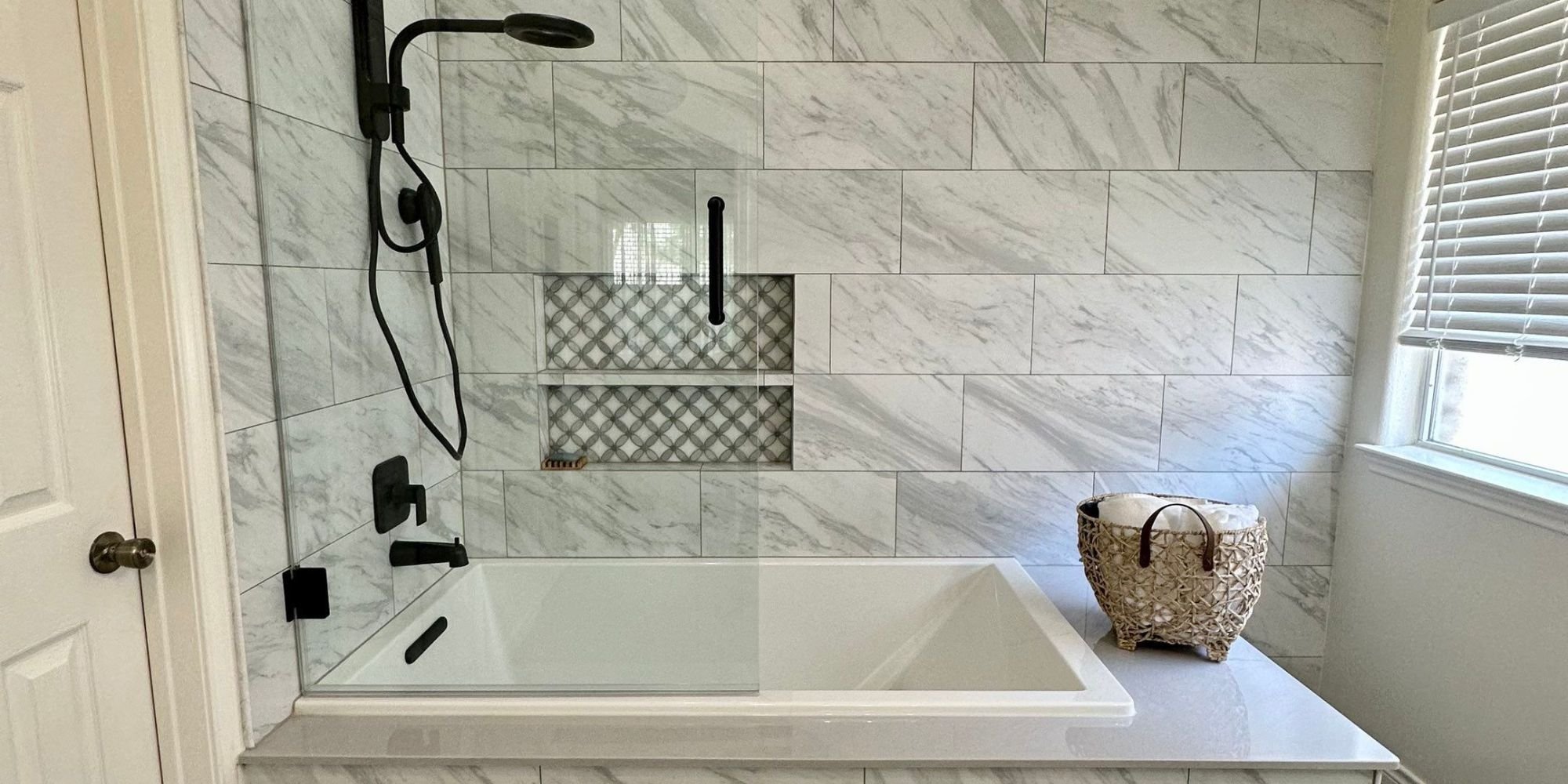 black and white bathroom remodel with marble shower